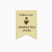 コーヒーカップと四葉のクローバーのバナーロゴ